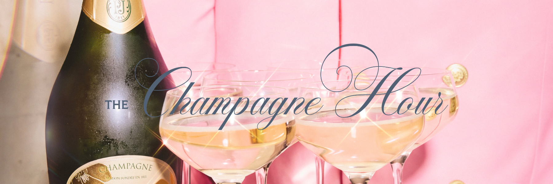 A champagne bottle and coupe glasses filled with sparkling wine against a pink backdrop, with “The Champagne Hour” text.