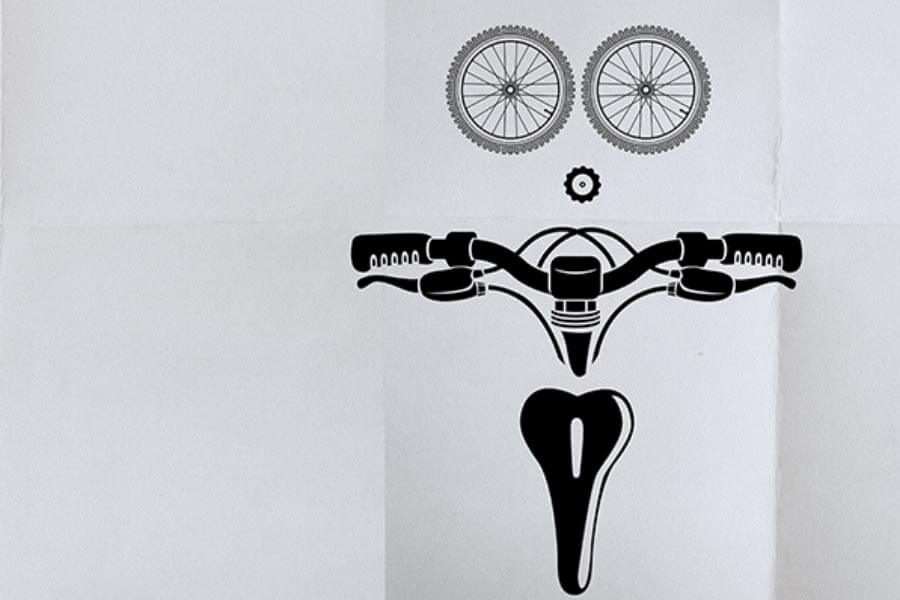 A minimalist black and white illustration featuring bicycle handlebars, wheels, and a seat, arranged to resemble a face.